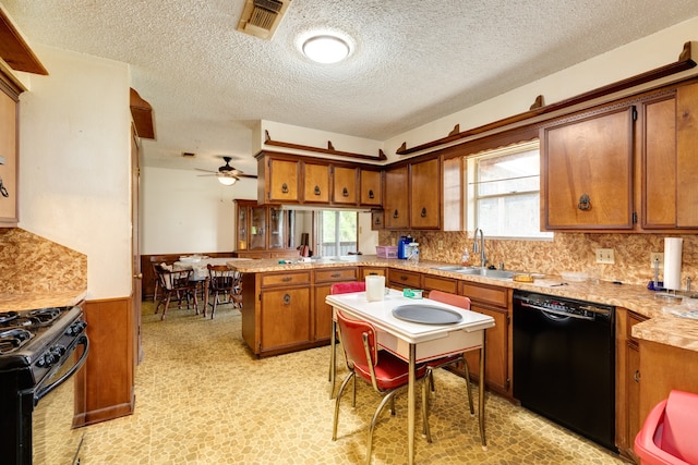 kitchen with black appliances, ceiling fan, plenty of natural light, and kitchen peninsula