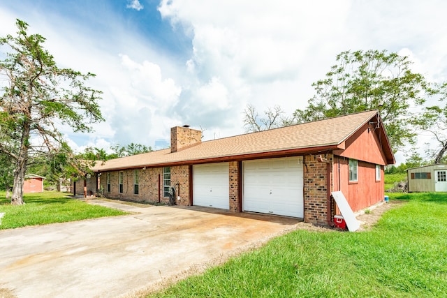 single story home with a garage and a front lawn