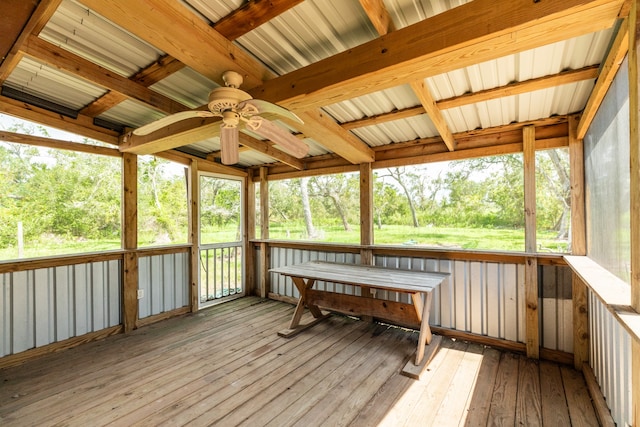 unfurnished sunroom with a healthy amount of sunlight and ceiling fan