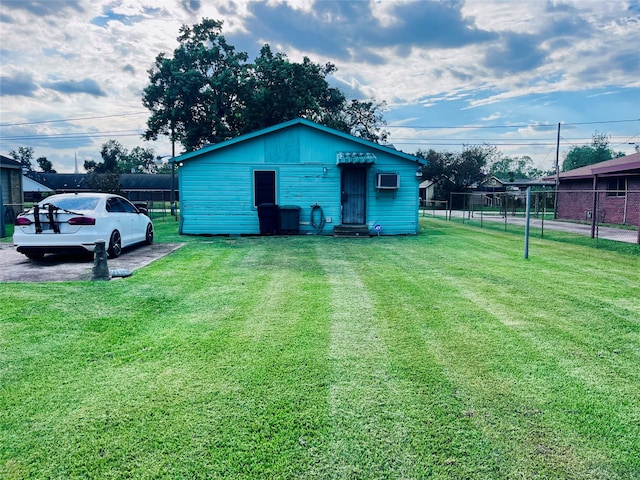 view of outbuilding with a lawn