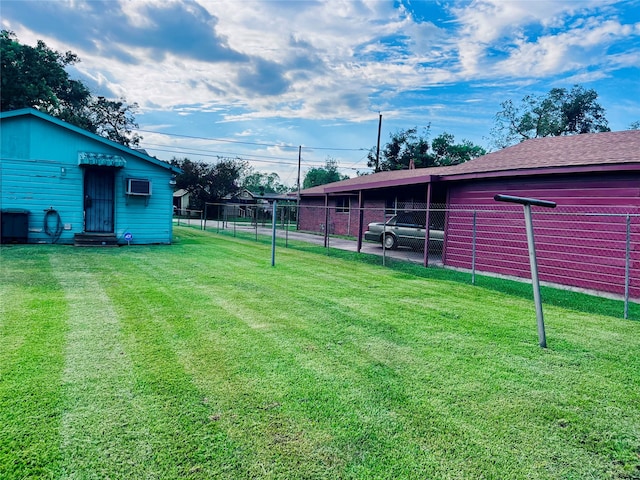 view of yard with a wall mounted air conditioner