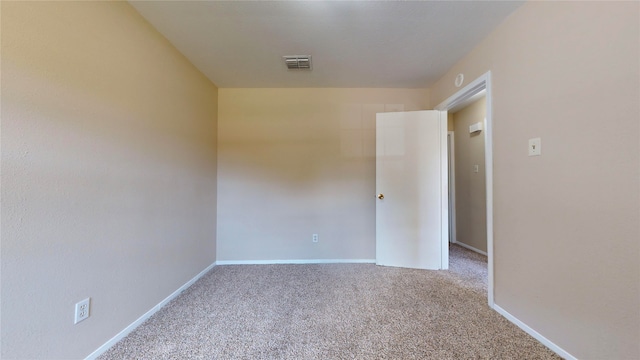 unfurnished room with carpet flooring