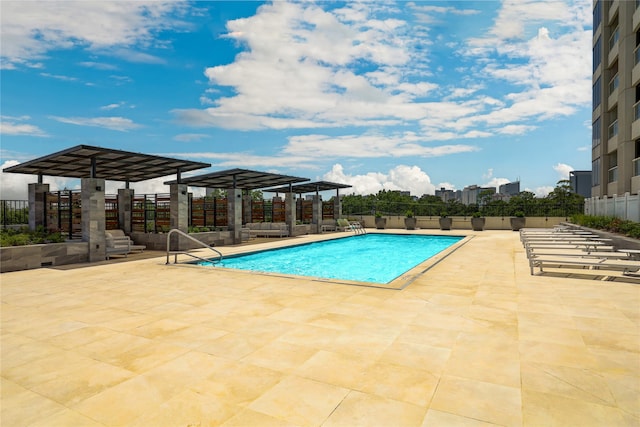 view of pool with a pergola and a patio area