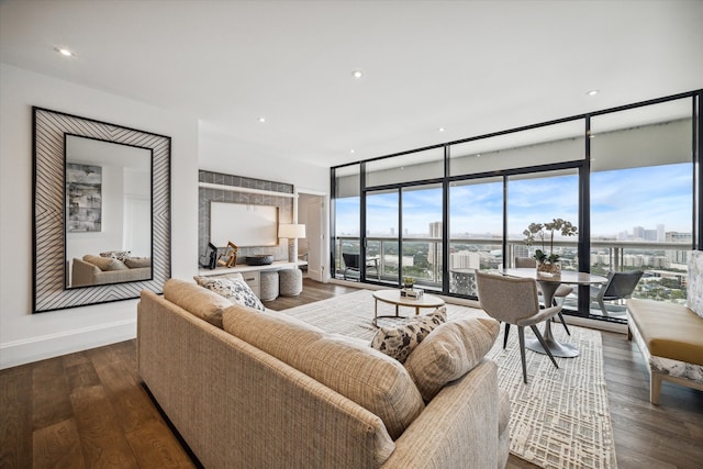 living room with expansive windows and hardwood / wood-style flooring