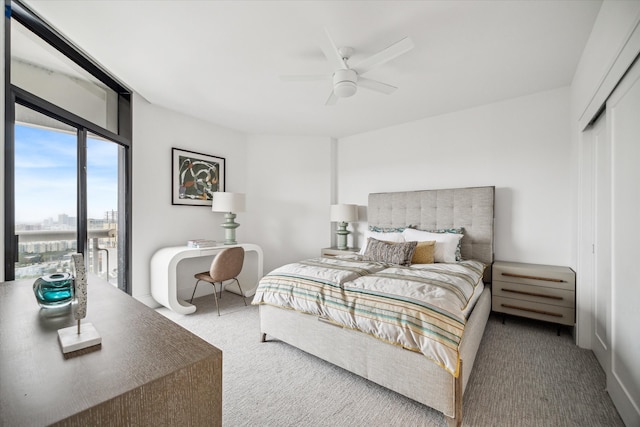 bedroom with ceiling fan, a closet, and carpet floors