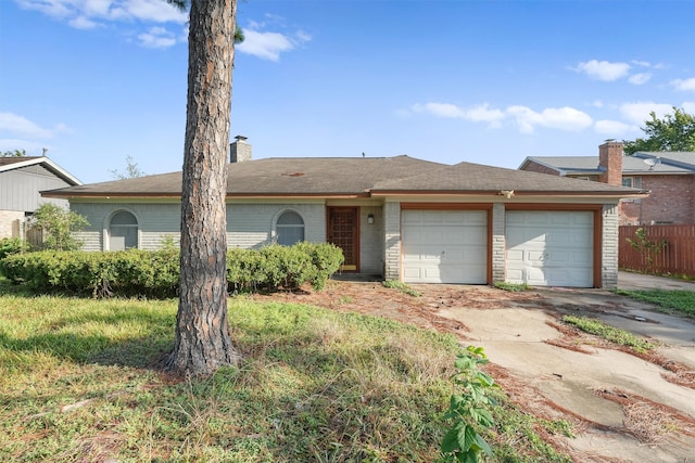 single story home featuring a garage