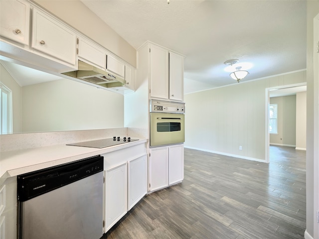 kitchen featuring dishwasher, oven, wood-type flooring, and white cabinets