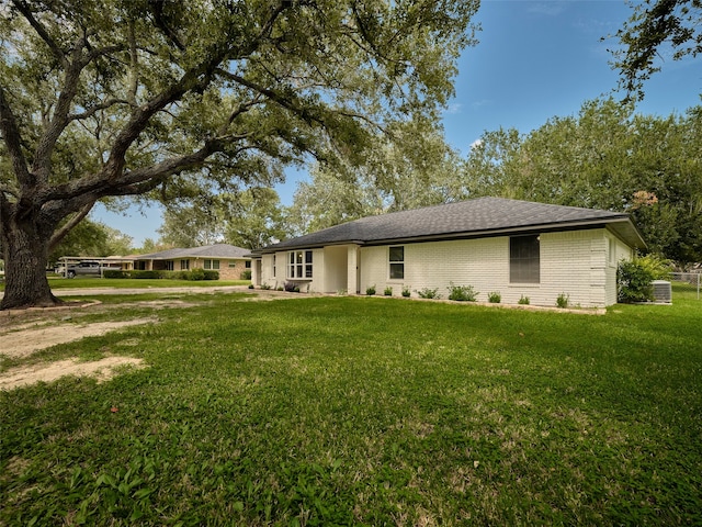 back of house with a yard