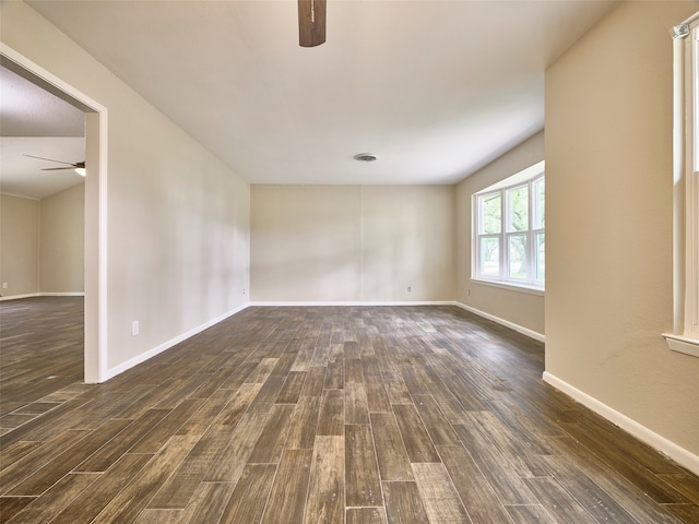 unfurnished room featuring ceiling fan and dark hardwood / wood-style flooring