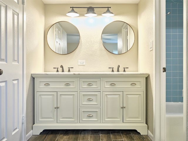 bathroom with vanity and hardwood / wood-style floors