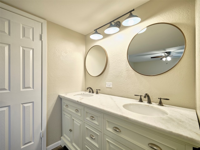 bathroom featuring ceiling fan and vanity