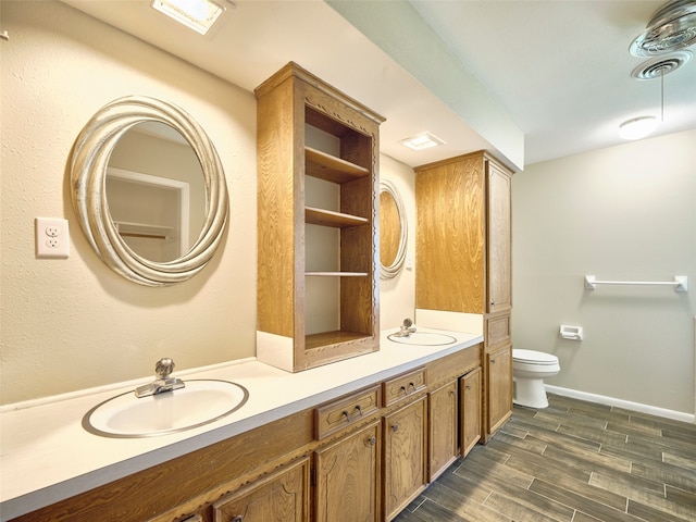 bathroom featuring hardwood / wood-style floors, toilet, and vanity