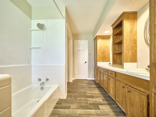 bathroom with hardwood / wood-style floors, independent shower and bath, and vanity