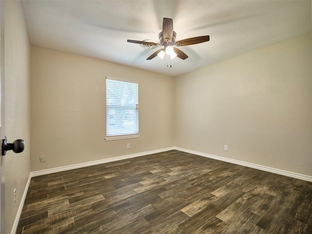 unfurnished room featuring ceiling fan, dark hardwood / wood-style floors, and a textured ceiling