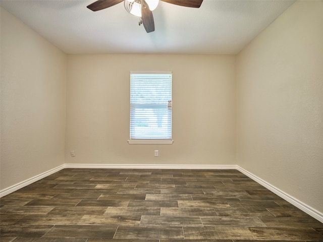 spare room featuring ceiling fan and dark hardwood / wood-style floors