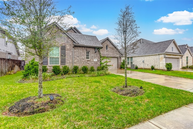 view of front of property with cooling unit, a garage, and a front yard