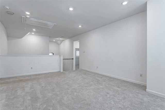 interior space featuring lofted ceiling and light colored carpet