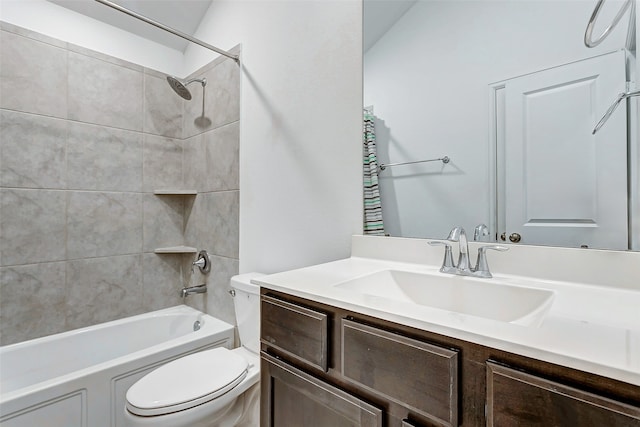 full bathroom with lofted ceiling, toilet, tiled shower / bath combo, and vanity