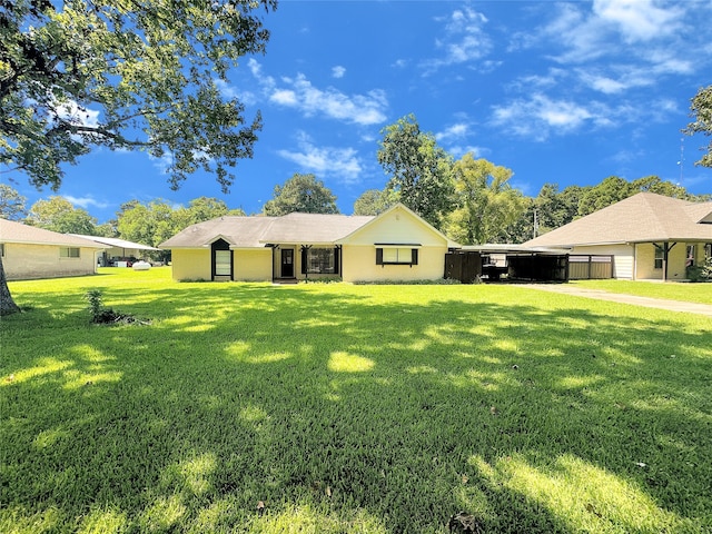 single story home with a carport and a front yard