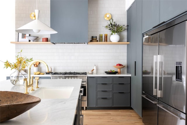 505 Graceland St, Houston, TX 77009 - kitchen with light wood-style flooring, a sink, gray cabinets, open shelves, and stainless steel refrigerator with ice dispenser