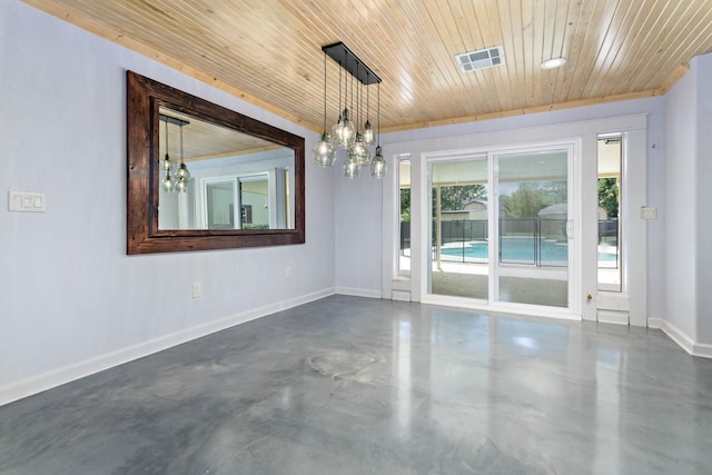 spare room with concrete floors, a notable chandelier, and wooden ceiling