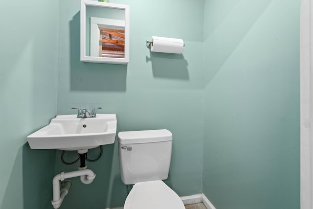 bathroom with toilet and sink