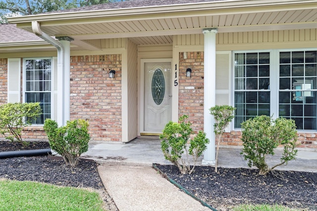 doorway to property featuring covered porch