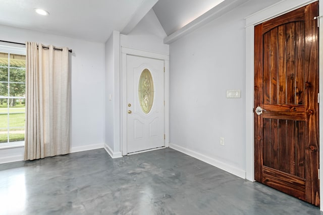 entrance foyer with vaulted ceiling