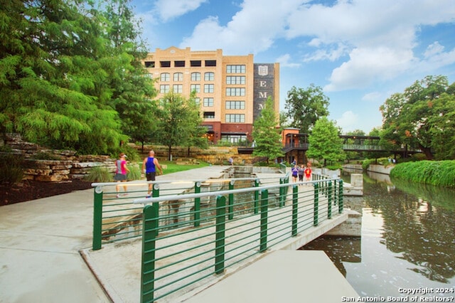 view of community with a water view