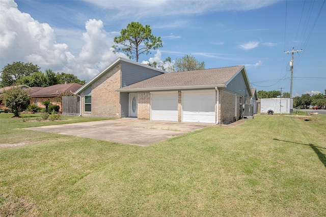 view of front facade with a front yard and a garage