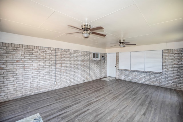 unfurnished sunroom featuring ceiling fan