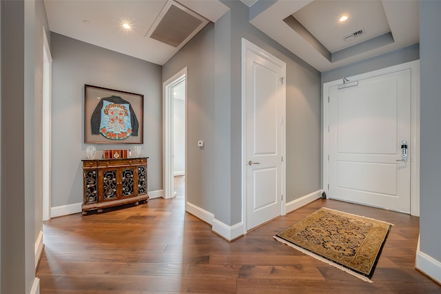 foyer with dark hardwood / wood-style flooring