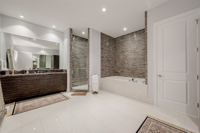 bathroom with vanity, independent shower and bath, and tile patterned floors