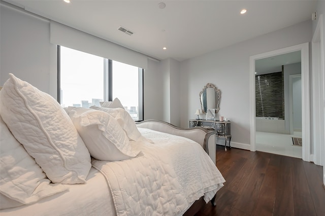 bedroom featuring dark hardwood / wood-style flooring