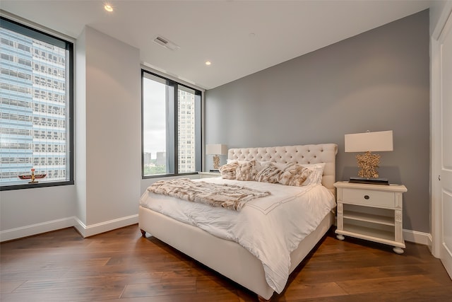 bedroom featuring dark hardwood / wood-style flooring