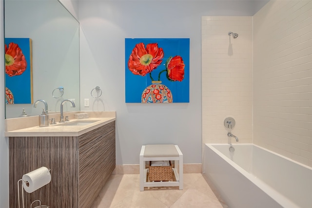 bathroom featuring tile patterned floors, tiled shower / bath combo, and vanity