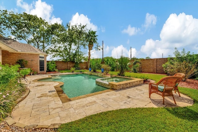 view of swimming pool featuring a patio and an in ground hot tub