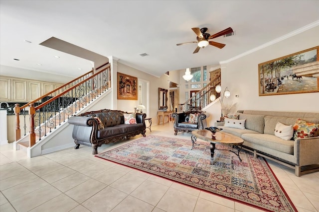 tiled living room with ceiling fan and crown molding