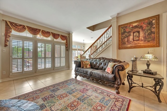 living room with ornamental molding and light tile patterned floors