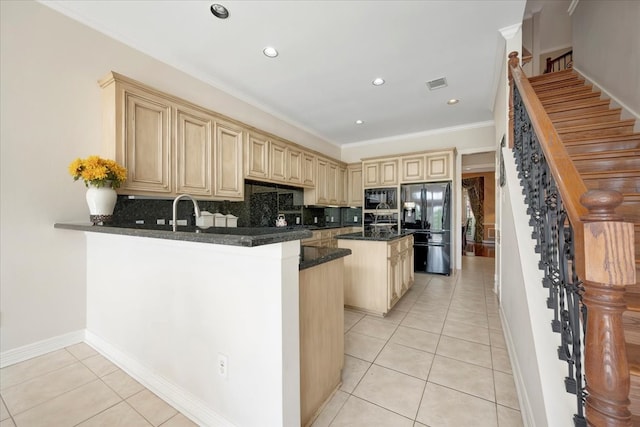 kitchen featuring black appliances, kitchen peninsula, light tile patterned floors, and tasteful backsplash