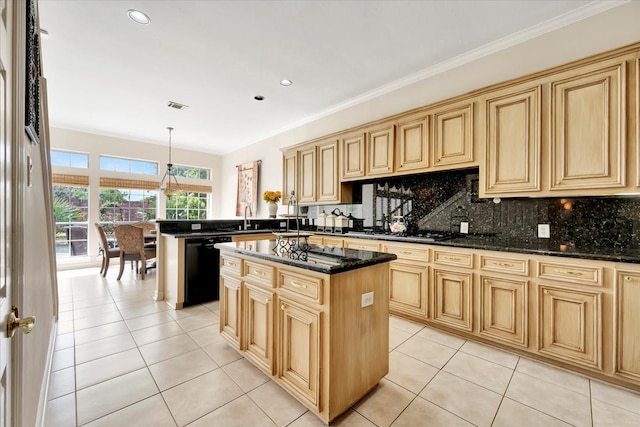 kitchen featuring dark stone countertops, dishwasher, a center island, decorative light fixtures, and light tile patterned flooring