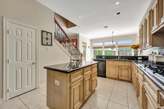 kitchen with dishwasher, sink, a center island, and light tile patterned flooring