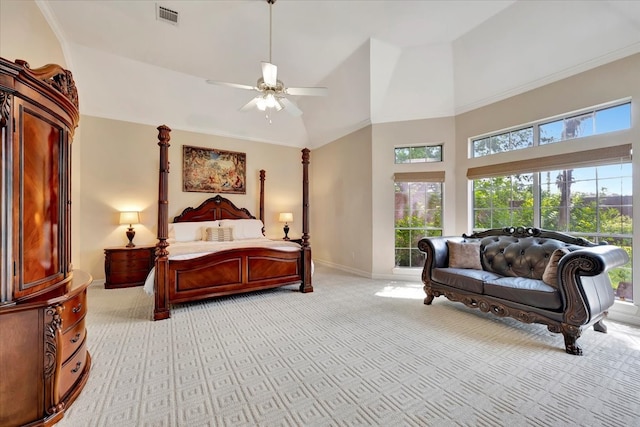 carpeted bedroom featuring ornamental molding, high vaulted ceiling, and ceiling fan