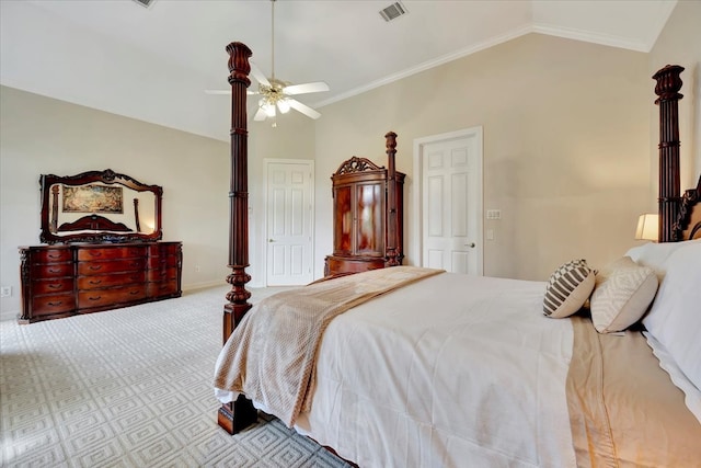 carpeted bedroom with ceiling fan, crown molding, and vaulted ceiling