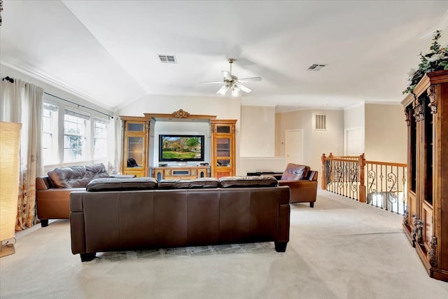 living room with ceiling fan, crown molding, light carpet, and vaulted ceiling