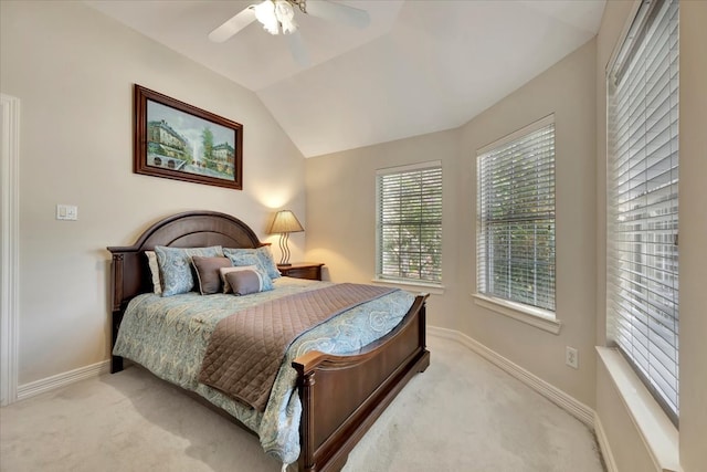 bedroom featuring lofted ceiling, light colored carpet, and ceiling fan