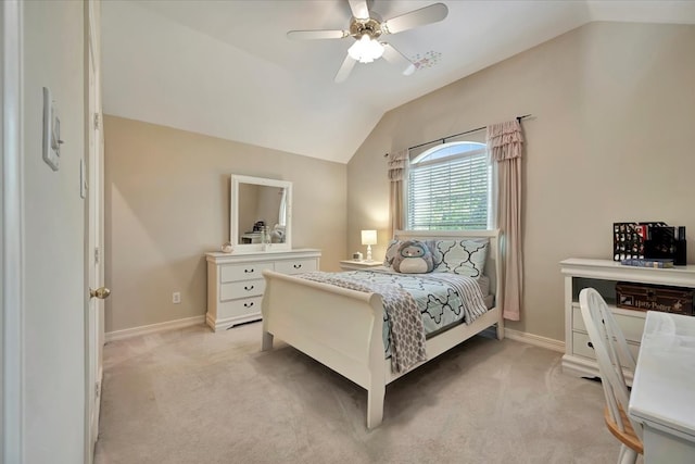 bedroom with light colored carpet, vaulted ceiling, and ceiling fan