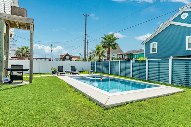 view of pool with a yard and a patio