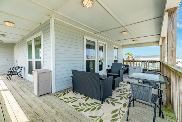 wooden terrace featuring outdoor lounge area