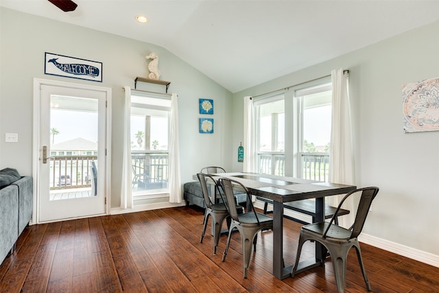 dining space with lofted ceiling, ceiling fan, and dark hardwood / wood-style floors